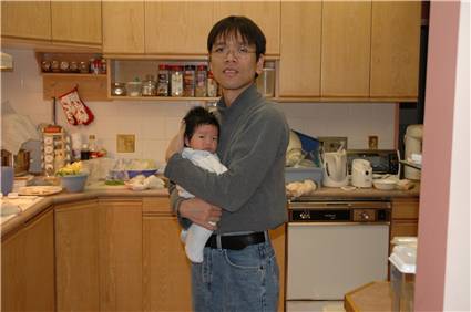 Dancing with daddy in the kitchen